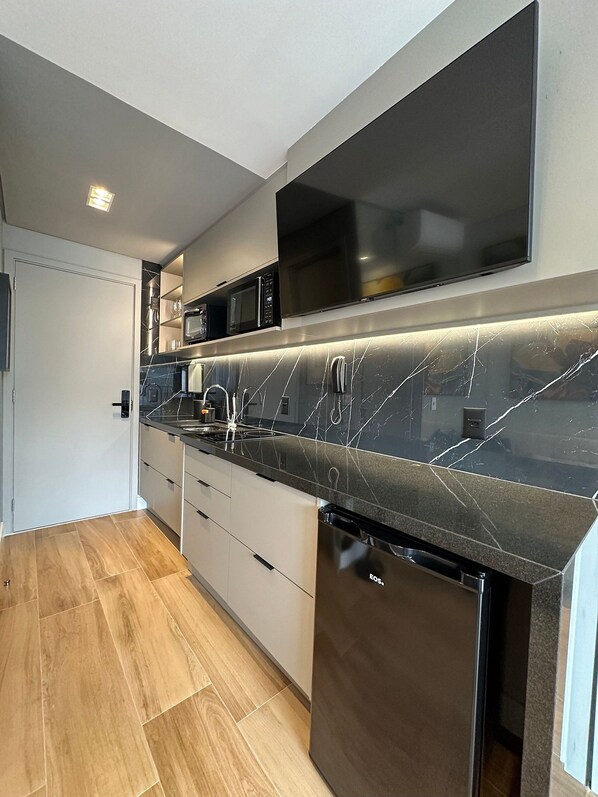 Fridge, microwave, cookware/dishes/utensils