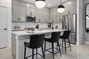 Fridge, microwave, oven, stovetop - Vivian's View | Chic Home w Luxe Amenities, Theme BR & Huge LR/DR - Near Airport (Orlando)