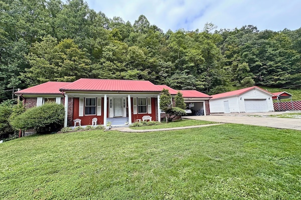 Front w/ driveway garage & carport