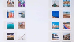 A wall with multiple framed photographs of various coastal scenes, including beaches, lighthouses, and cityscapes. - Designer Flat in Heart of Brighton - Walk to Beach & Attractions! (Brighton and Hove)