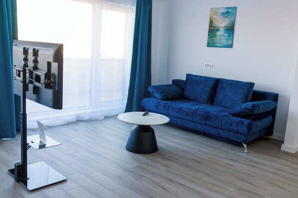 Superior Apartment, 2 Bedrooms | Living area | Flat-screen TV