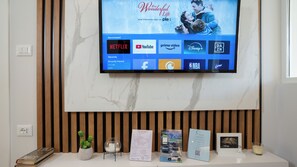 Welcome to our reception area, where you can check in and enjoy a flat-screen TV and comfortable seating.