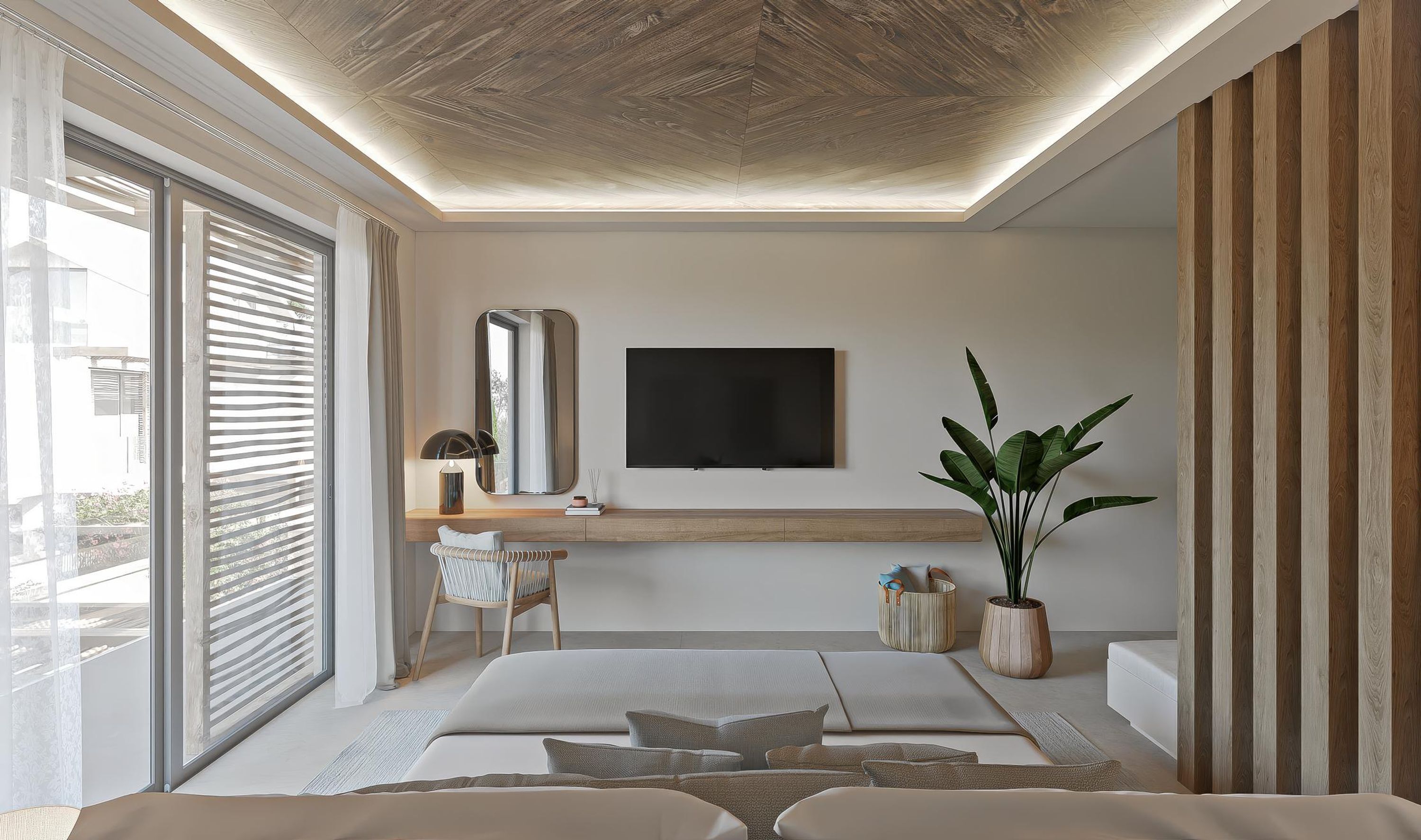 A modern bedroom with a large bed, a TV mounted on the wall, and a potted plant.