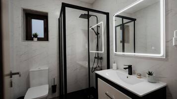 Een haardroger, handdoeken, shampoo, toiletpapier