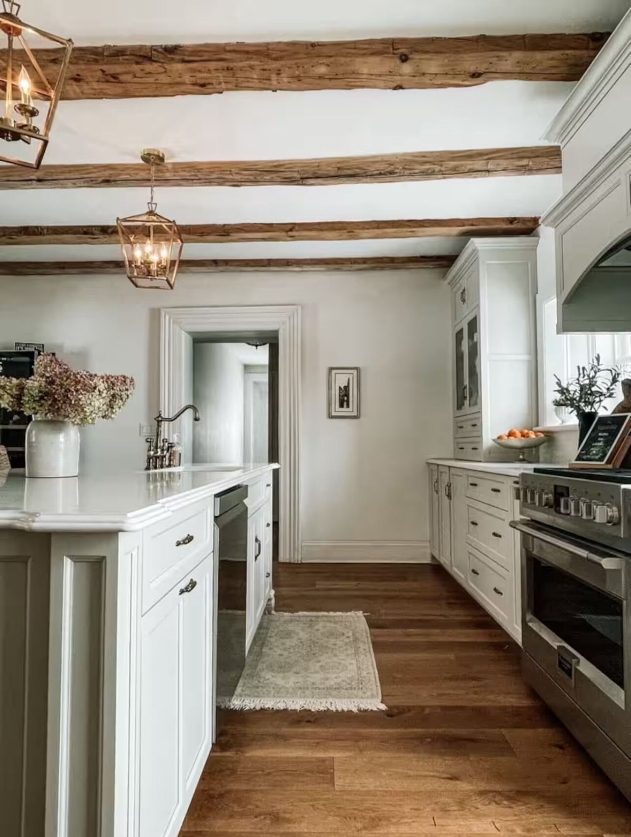 Large kitchen with original wood beams.