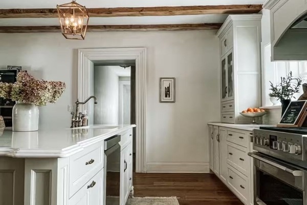 Large kitchen with original wood beams.