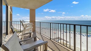 A balcony with a view of a beach and ocean. - 🌞Beachfront Bliss | Gulf Views | Amazing Amenities | Phoenix I 1097🌞 (Orange Beach)