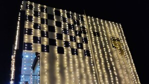 A building with a checkered facade pattern and numerous windows. - hotel basurivala  (Bhopal)