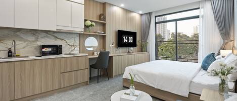 Suite estudio de lujo, vista a la ciudad | Ropa de cama de alta calidad, edredón y camas con efecto memoria