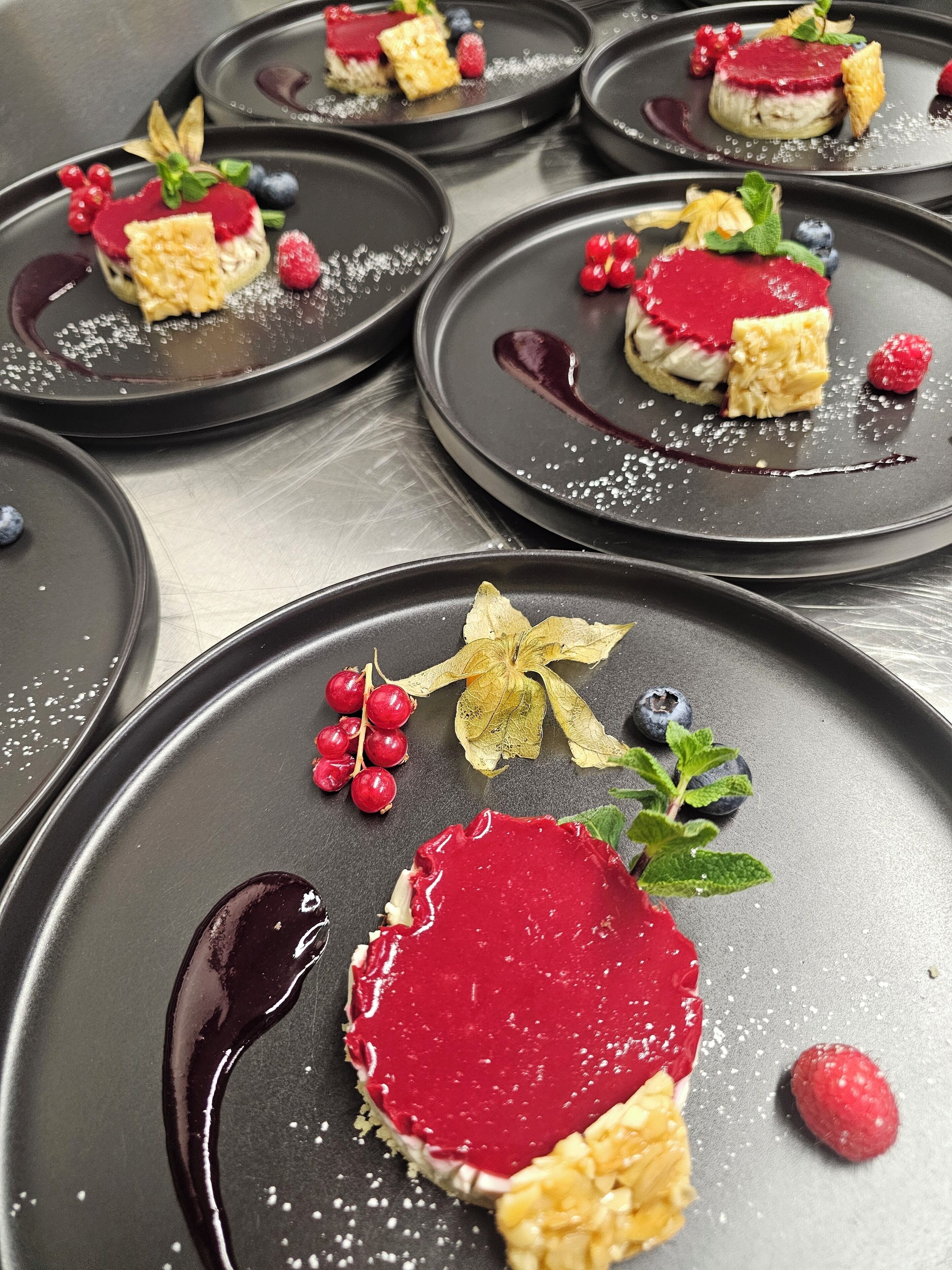 A series of dessert plates with various toppings and garnishes.