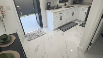 Fridge, microwave, stovetop, coffee/tea maker