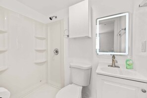 Shower, hair dryer, towels, shampoo