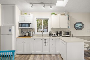 Fridge, microwave, oven, stovetop - Beach Front Retreat :Private Beach and Dock Access, Hot Tub, BBQ &Free Kayaks! (Sooke)