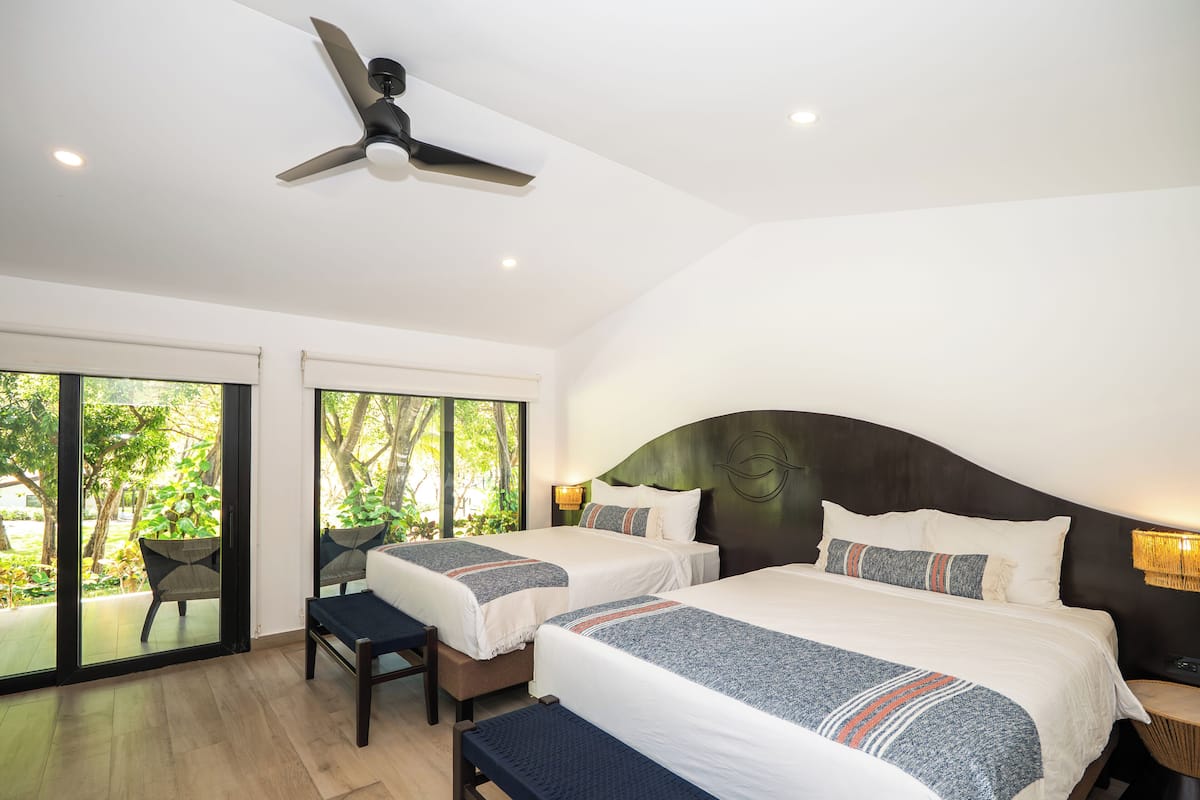 Double Room, 2 Queen Beds, Patio, Garden View | In-room safe, free WiFi, bed sheets