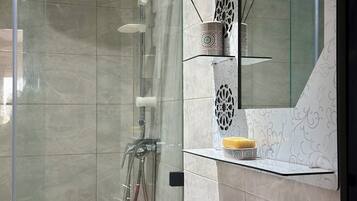 Shower, hair dryer, towels, soap