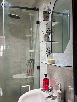 Shower, hair dryer, towels, soap