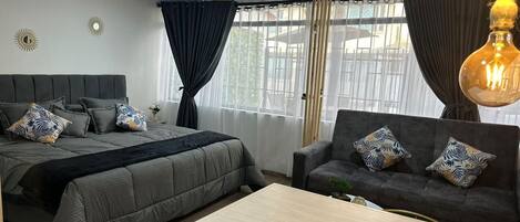 Laptop workspace, blackout drapes, soundproofing, iron/ironing board