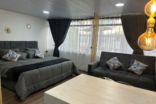 Laptop workspace, blackout curtains, soundproofing, iron/ironing board