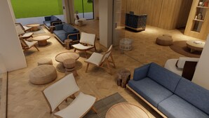 Un interior moderno con un sofá azul, muebles de madera y una televisión.