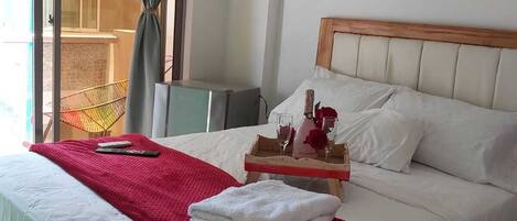 Hypo-allergenic bedding, down comforters, minibar, laptop workspace