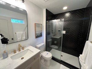 Shower, hair dryer, towels, soap