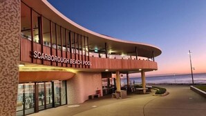 A building with a curved facade and the name "Scarborough Beach Pool" visible. - Scarborough Shores - Beachfront (Scarborough)