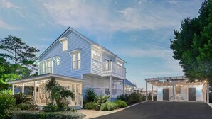 A two-story house with a covered porch and a garage. - Walk to Blue Mountain Beach, Private Pool, Hot Tub 30A Sea-renity by Avantstay (Santa Rosa Beach)