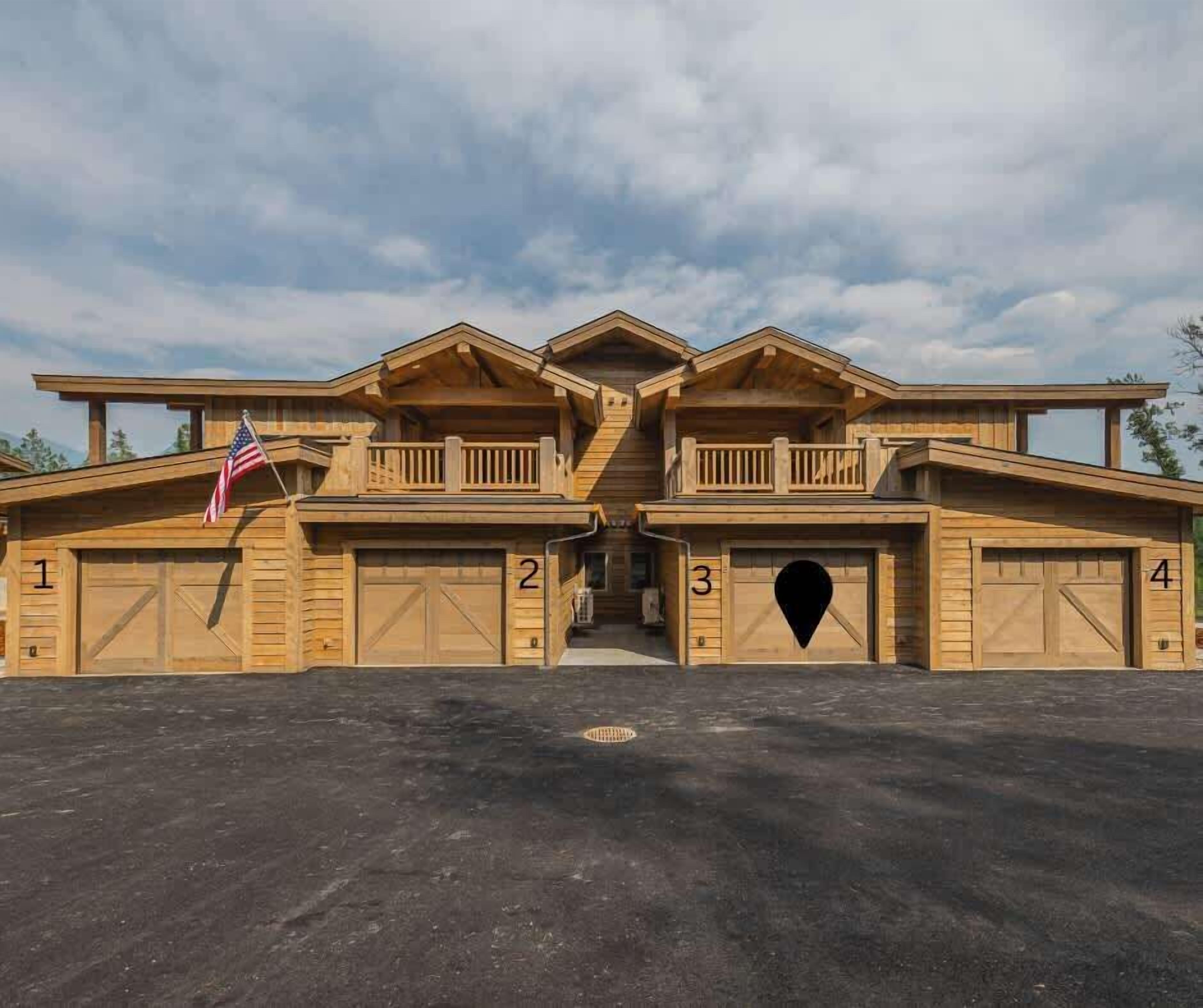 A large, multi-garage building with four numbered garages and a central entrance.
