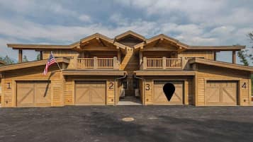 A large, multi-garage building with four numbered garages and a central entrance.