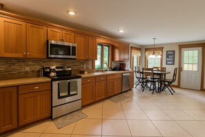 Dishwasher, coffee/tea maker, cookware/dishes/utensils