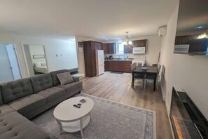 TV, fireplace - Springhouse Seaside Retreat 2-Bedroom on the Bay (Lewisporte)