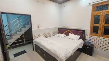 Deluxe Double Room, City View | In-room safe, desk, laptop workspace, blackout drapes