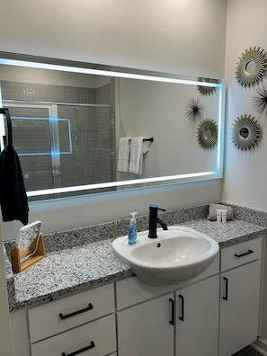 Shower, hair dryer, towels, soap