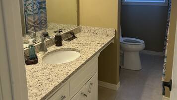Shower, towels, soap, toilet paper