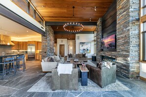 Televisie, een open haard, videospelletjes en een stereo