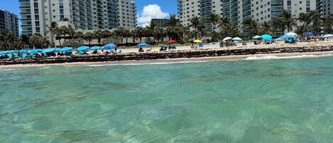 On the beach, sun loungers, beach towels