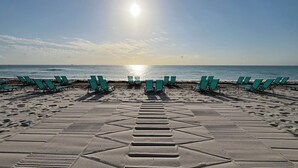 On the beach, sun loungers, beach towels