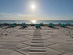 On the beach, sun loungers, beach towels