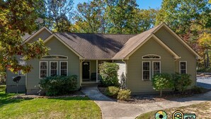 A two-story house with a front porch, a satellite dish, and a well-maintained lawn. - Pine Cone Paradise - escape to luxury! (Mount Jackson)