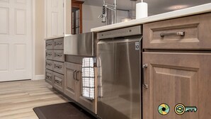 A modern kitchen with a stainless steel refrigerator, wooden cabinets, and a built-in oven. - Pine Cone Paradise - escape to luxury! (Mount Jackson)