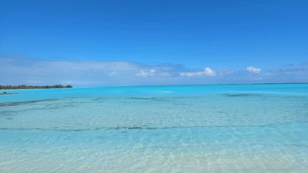 A clear blue sea with a distant shoreline and a clear sky. - Flyfishing Anaa Toku Kaiga (Anaa)