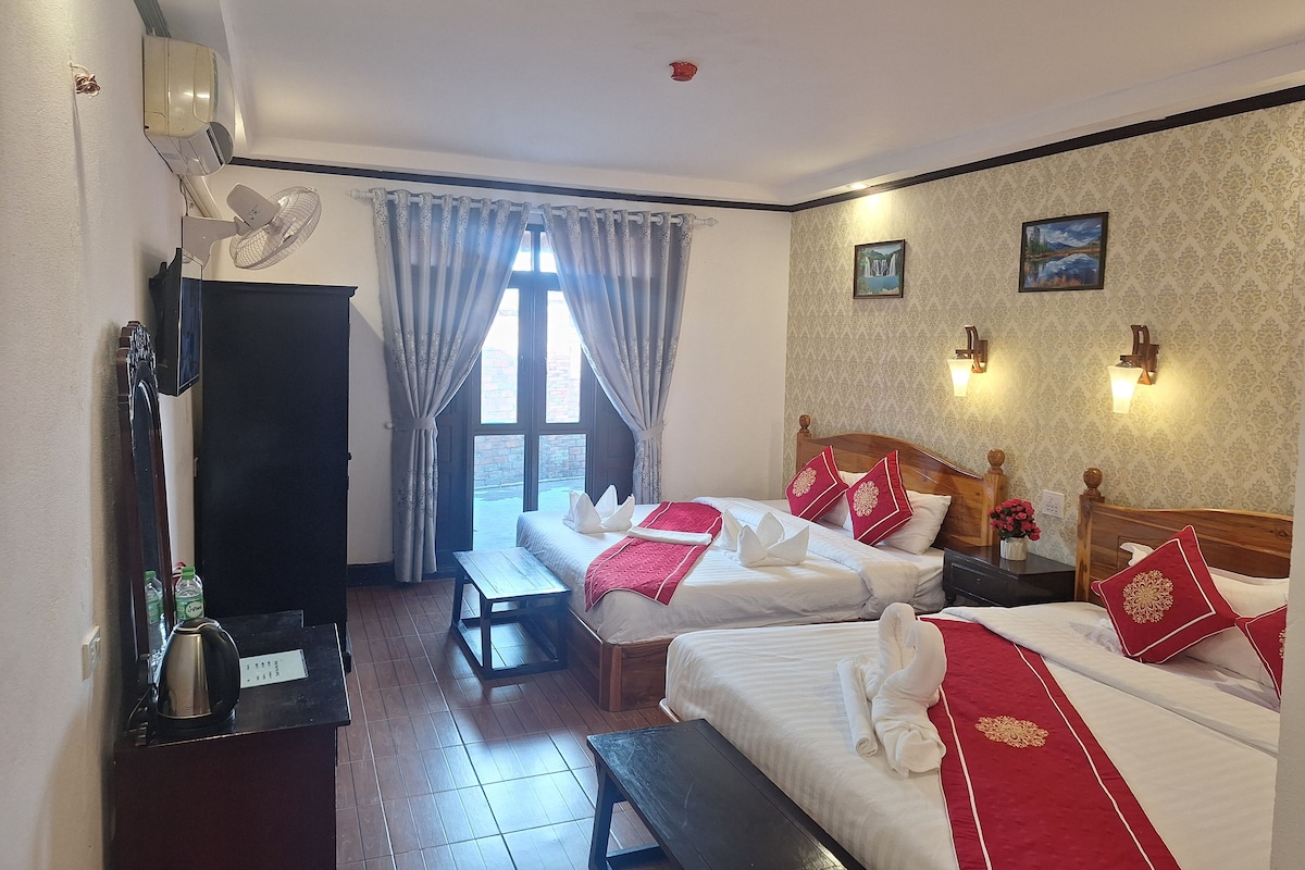 Deluxe Quadruple Room | Premium bedding, minibar, in-room safe, desk