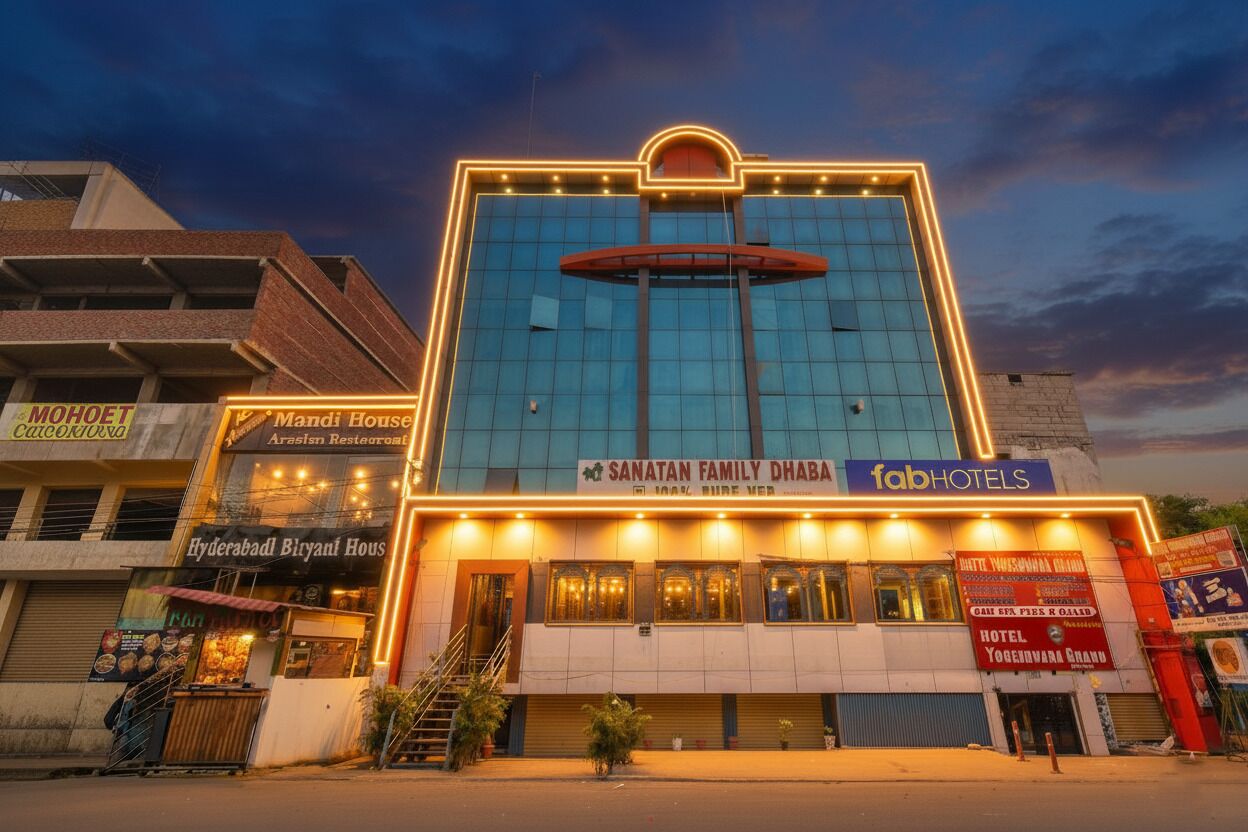 A hotel with multiple signage, including "Sanatan Family Dhaba" and "FabHotels".