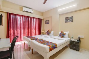 Egyptian cotton sheets, premium bedding, in-room safe, blackout drapes - Fabhotel Welcome Apartments (Mumbai)