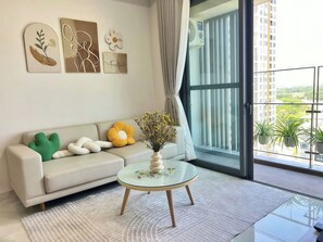 Superior Apartment, 2 Bedrooms, Kitchen, City View | Living area | 35-inch flat-screen TV with cable channels - The Antonia Apartments - Korea Town D7 (Ho Chi Minh City)