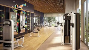 A gym with various exercise equipment, large windows, and a wooden ceiling. - The Antonia Apartments - Korea Town D7 (Ho Chi Minh City)