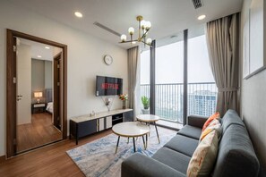 Deluxe Apartment, 2 Bedrooms, Kitchen, City View | Living area | 42-inch flat-screen TV with cable channels - Eco Green Saigon - Free Gym & Pool (Ho Chi Minh City)
