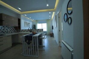 Fridge, oven, coffee/tea maker, cookware/dishes/utensils