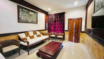 Double or Twin Room, Garden View | Living area | TV