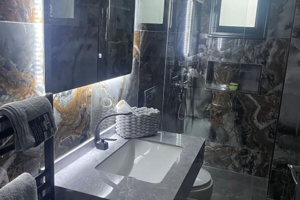 Shower, hair dryer, towels, soap